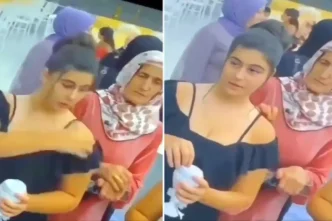 Dugunde cekilen garip goruntu Arkadaki kadinin hareketine dikkat