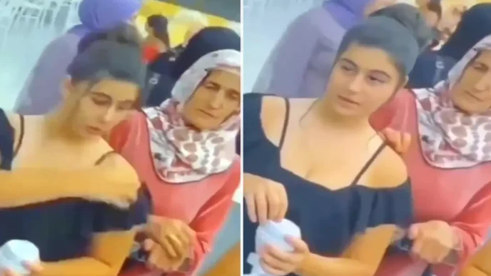 Dugunde cekilen garip goruntu Arkadaki kadinin hareketine dikkat